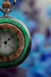 green and gold analog watch