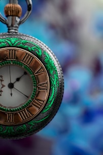 green and gold analog watch