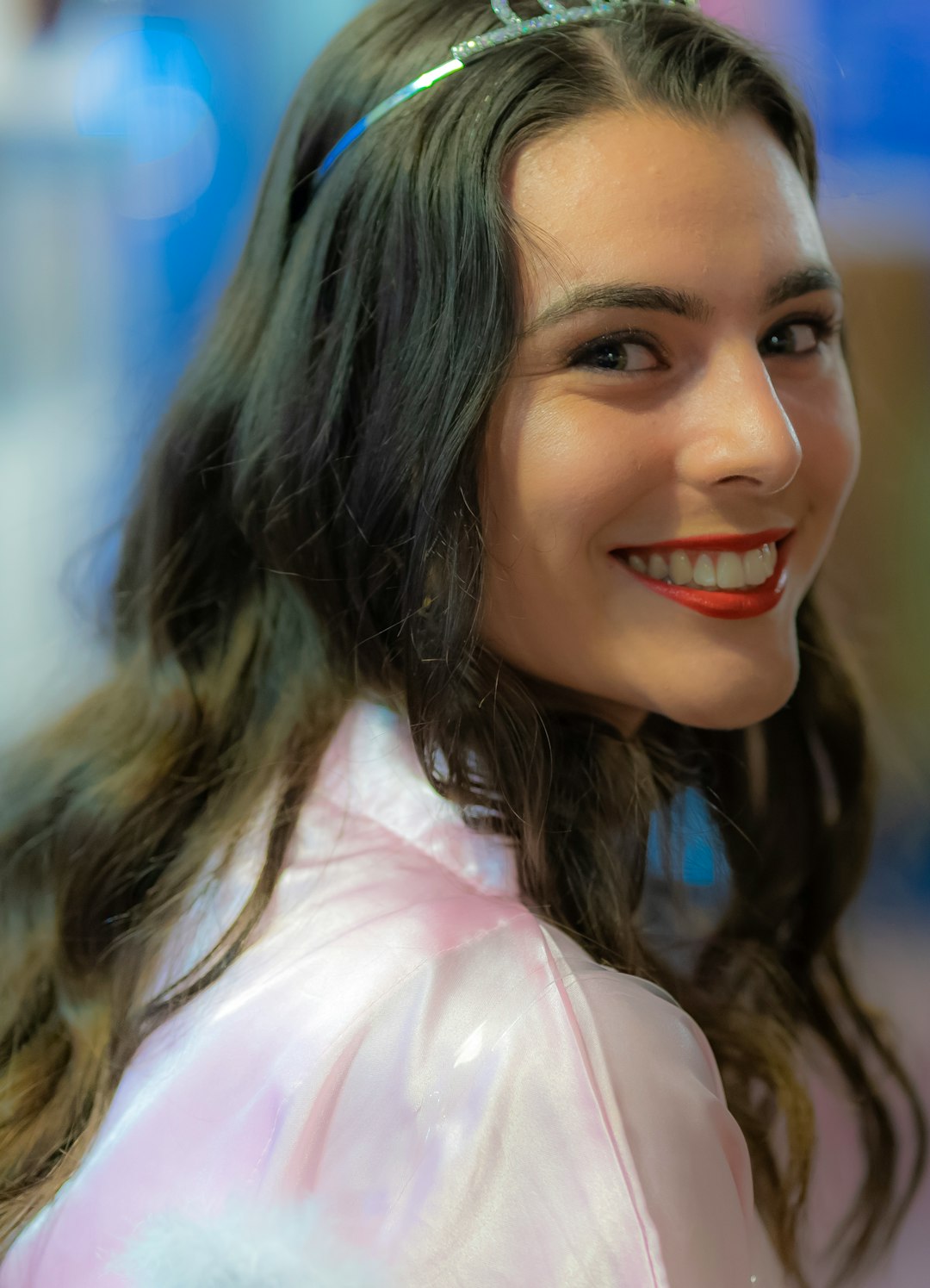 smiling woman in pink shirt