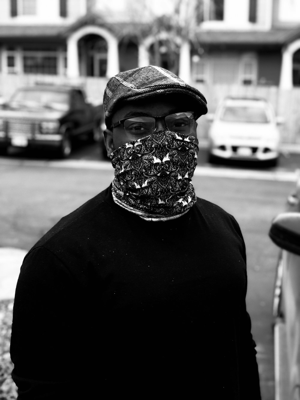 a man wearing a bandana and a hat