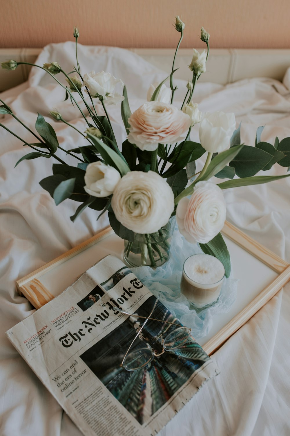 white roses on white table