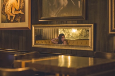 A welcoming salon corner with warm yellow-gold lighting.