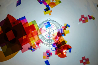 A vibrant plastic decorative centerpiece with geometric patterns on a table.