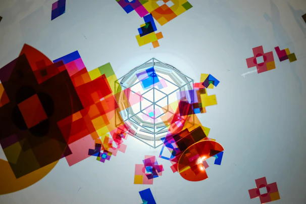 A vibrant plastic decorative centerpiece with geometric patterns on a table.