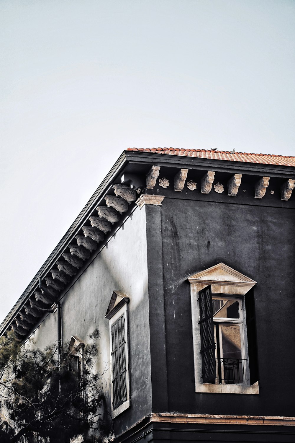 white concrete building with brown roof