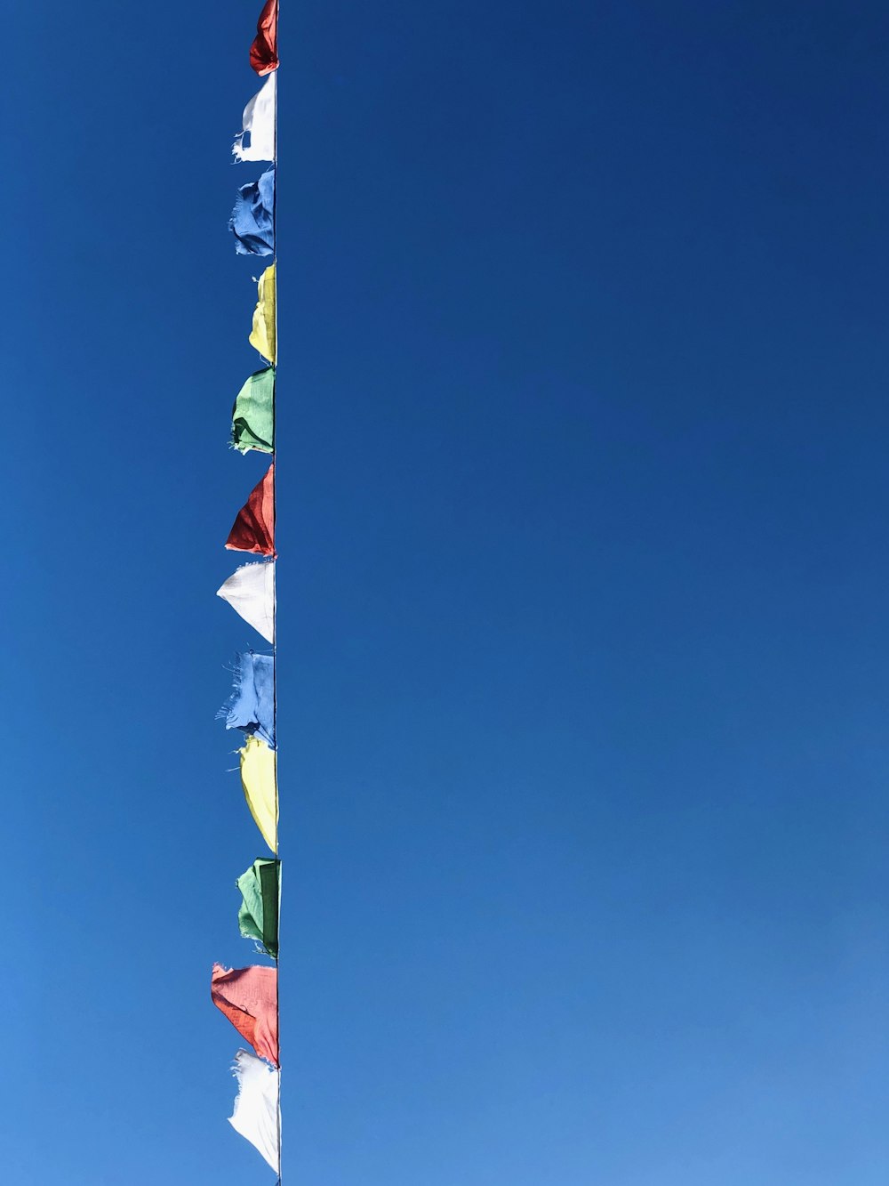 white red and blue flag under blue sky during daytime