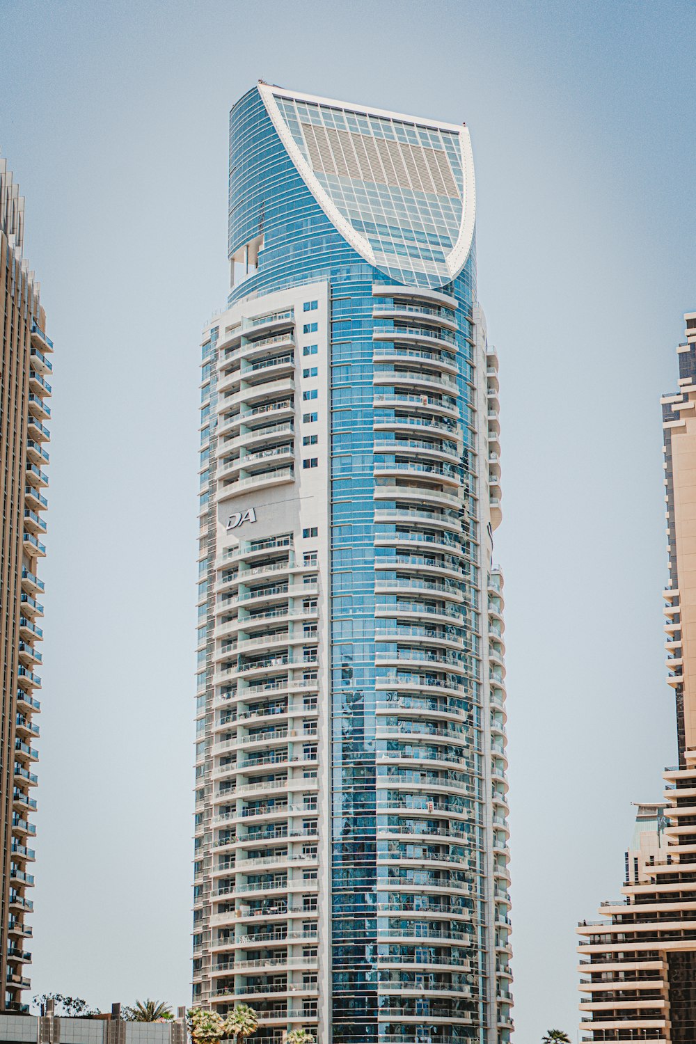 white and blue high rise building