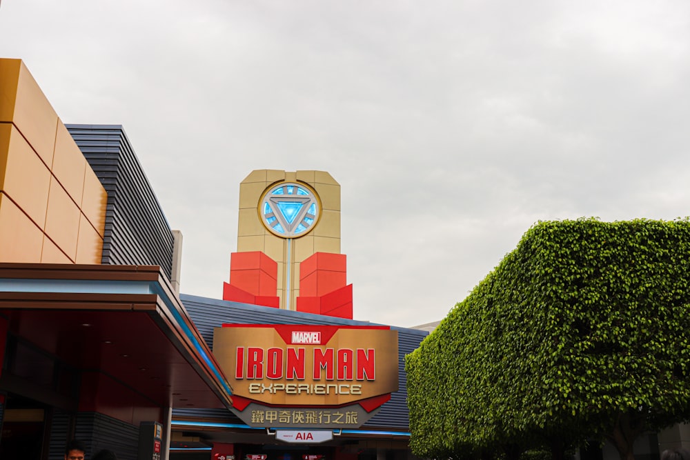 a large iron man sign on the side of a building