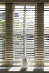 white window blinds during daytime