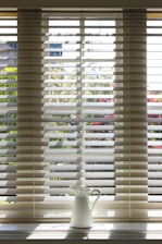 white window blinds during daytime