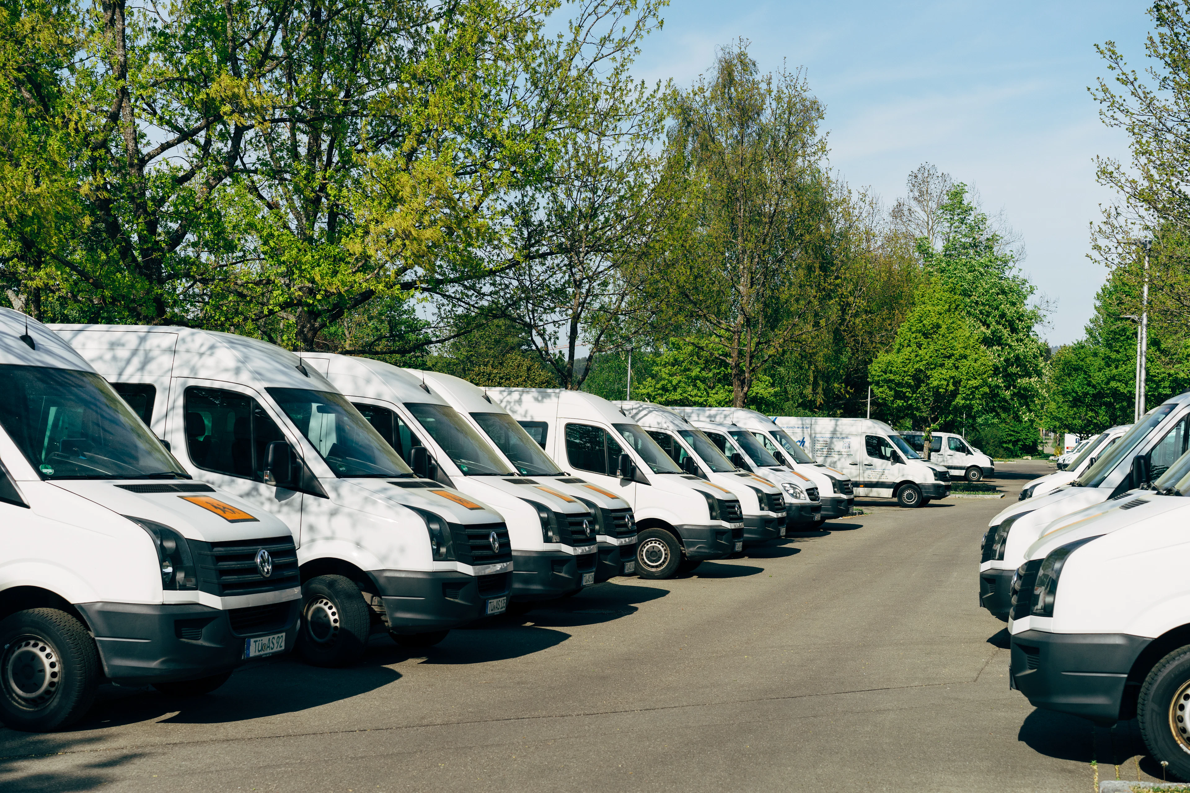 Row of white commercial vans