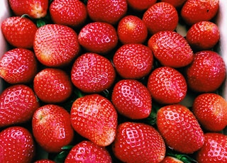 red strawberries on white ceramic plate