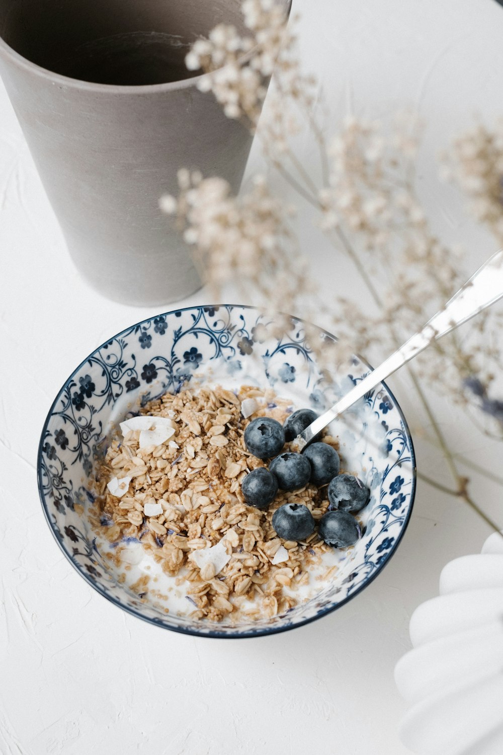 blue and white ceramic bowl with cereal