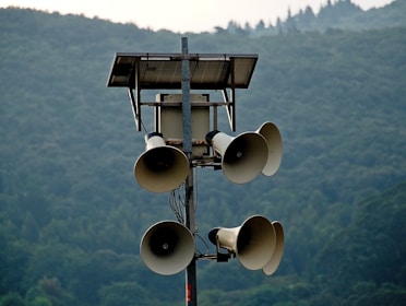 white street light turned on during daytime