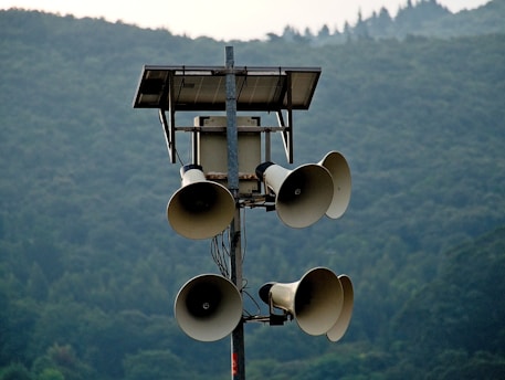 white street light turned on during daytime