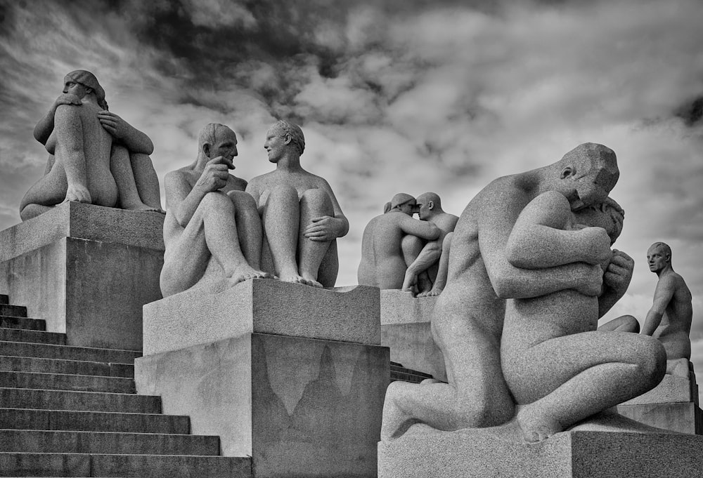 grayscale photo of statue of naked woman