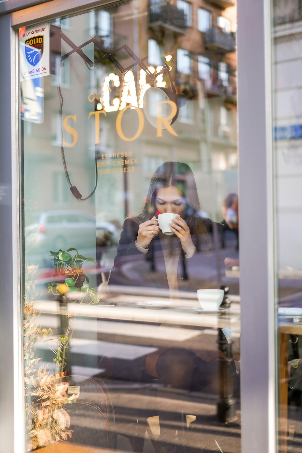 woman taking selfie in front of mirror