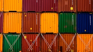 stack of red green and yellow wooden crates