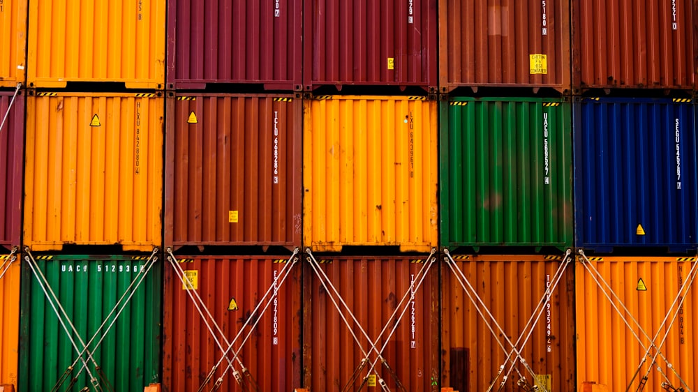 stack of red green and yellow wooden crates