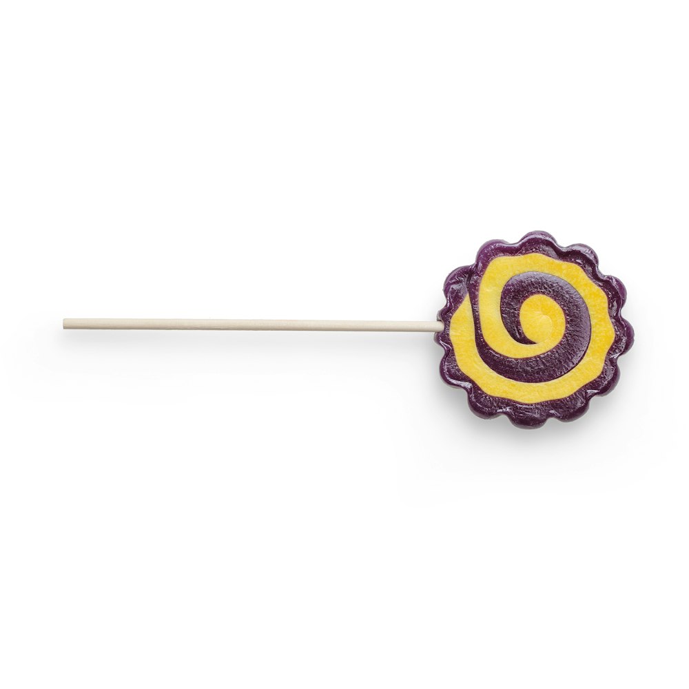 blue and yellow lollipop on white background