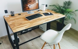 macbook pro on brown wooden table