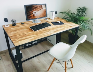 macbook pro on brown wooden table