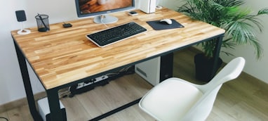 macbook pro on brown wooden table