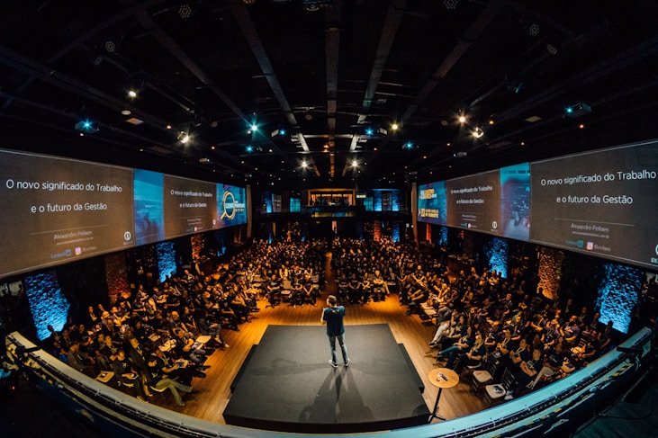 people sitting on chairs watching a game