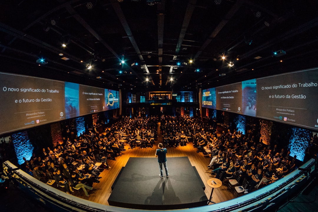 A man speaks in front of an audience.