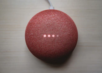 Modern modem device with glowing indicator lights on a sleek desk