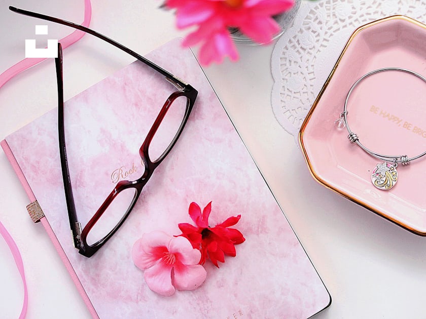 Black framed eyeglasses on white and pink floral textile photo – Free ...