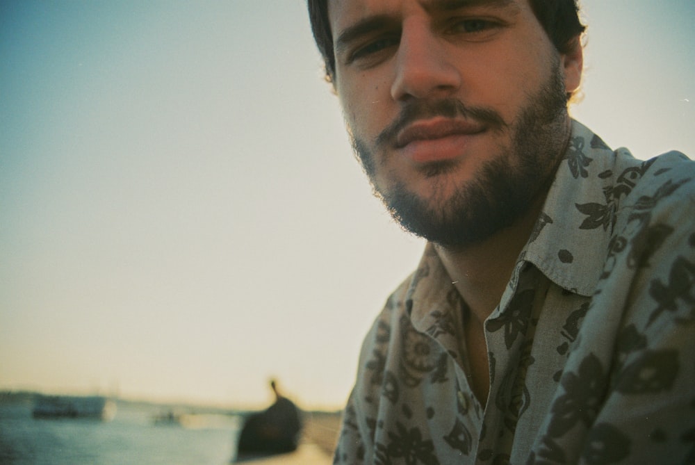 man in white and blue floral button up shirt