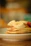 A colorful bowl of protein-packed vegan pancakes topped with fresh banana slices and berries.