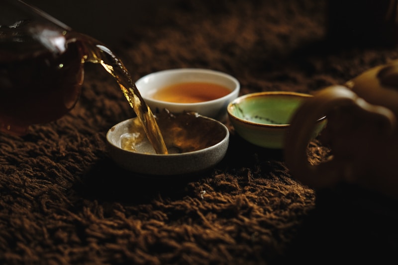 Loose tea leaves resting in a ceramic bowl