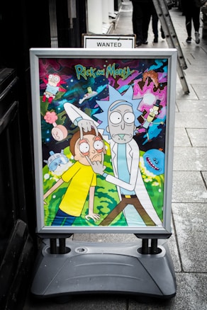 A colorful poster outside a building displays animated characters from a popular sci-fi animated series. The scene involves a scientist and a young boy in a comedic pose, surrounded by cosmic and surreal elements.