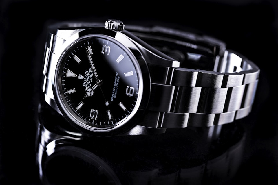 Close-up of an Omega automatic watch dial showing intricate movement details
