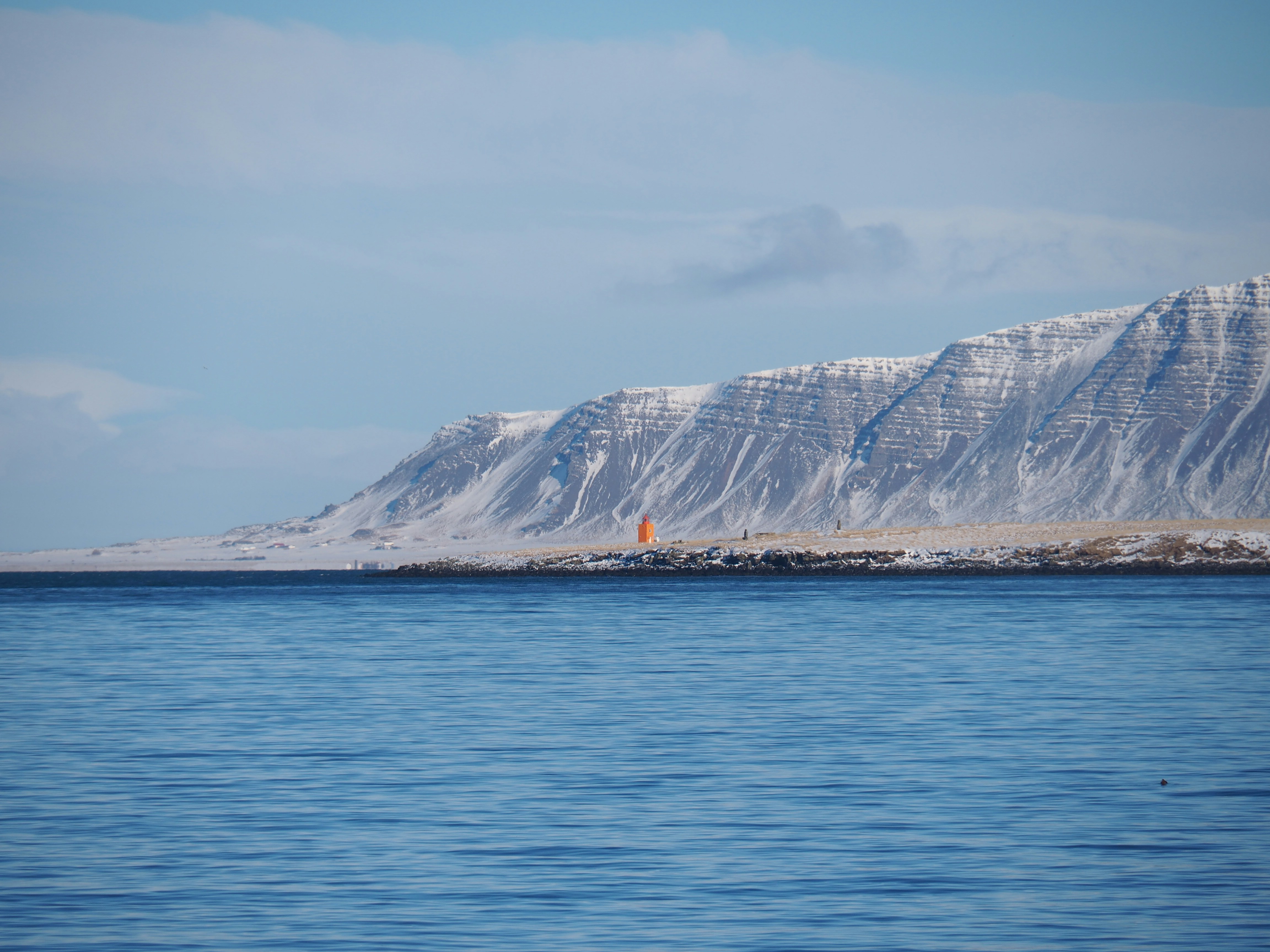 White and brown mountain near body of water during daytime photo – Free ...