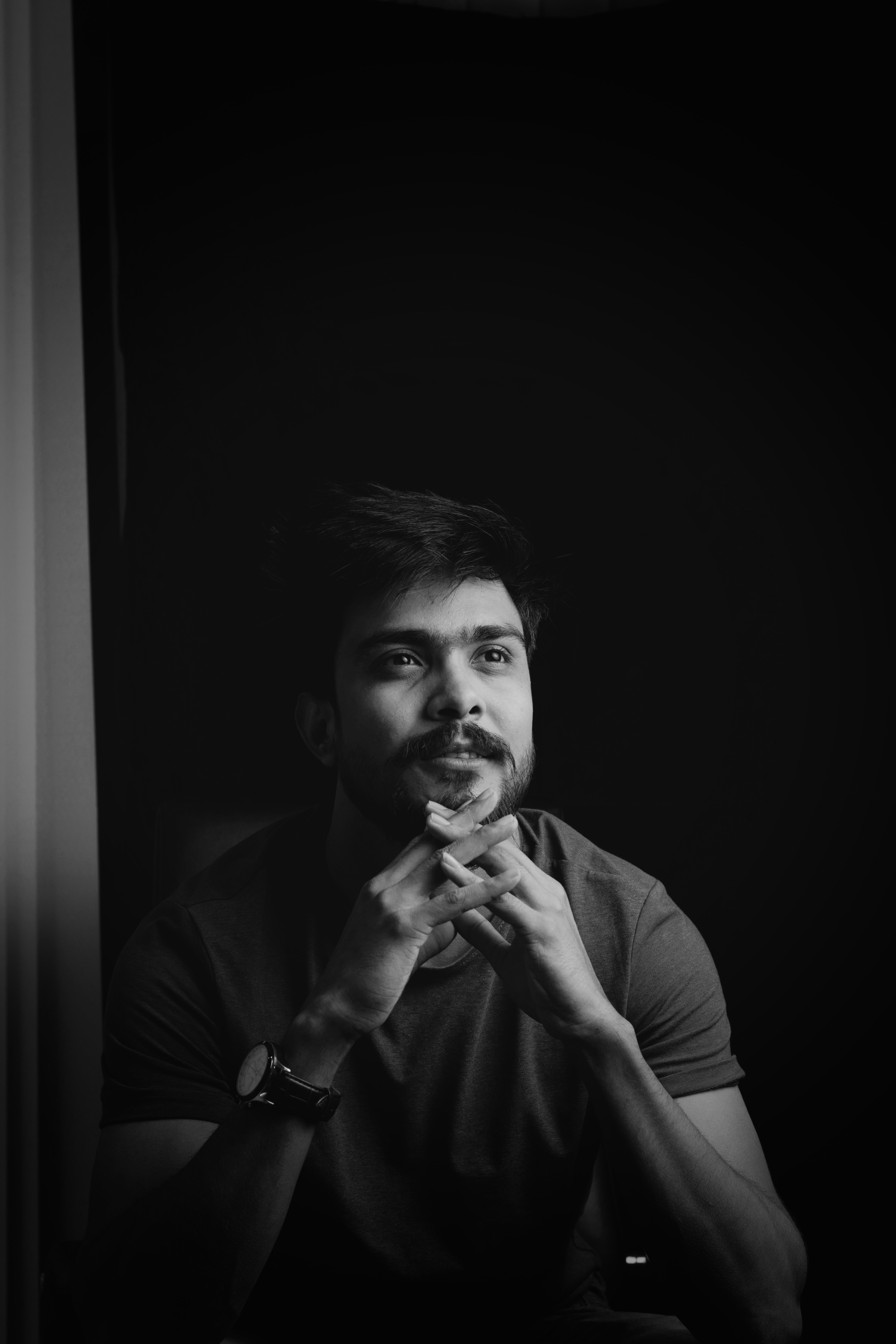 Pensive man stroking his beard