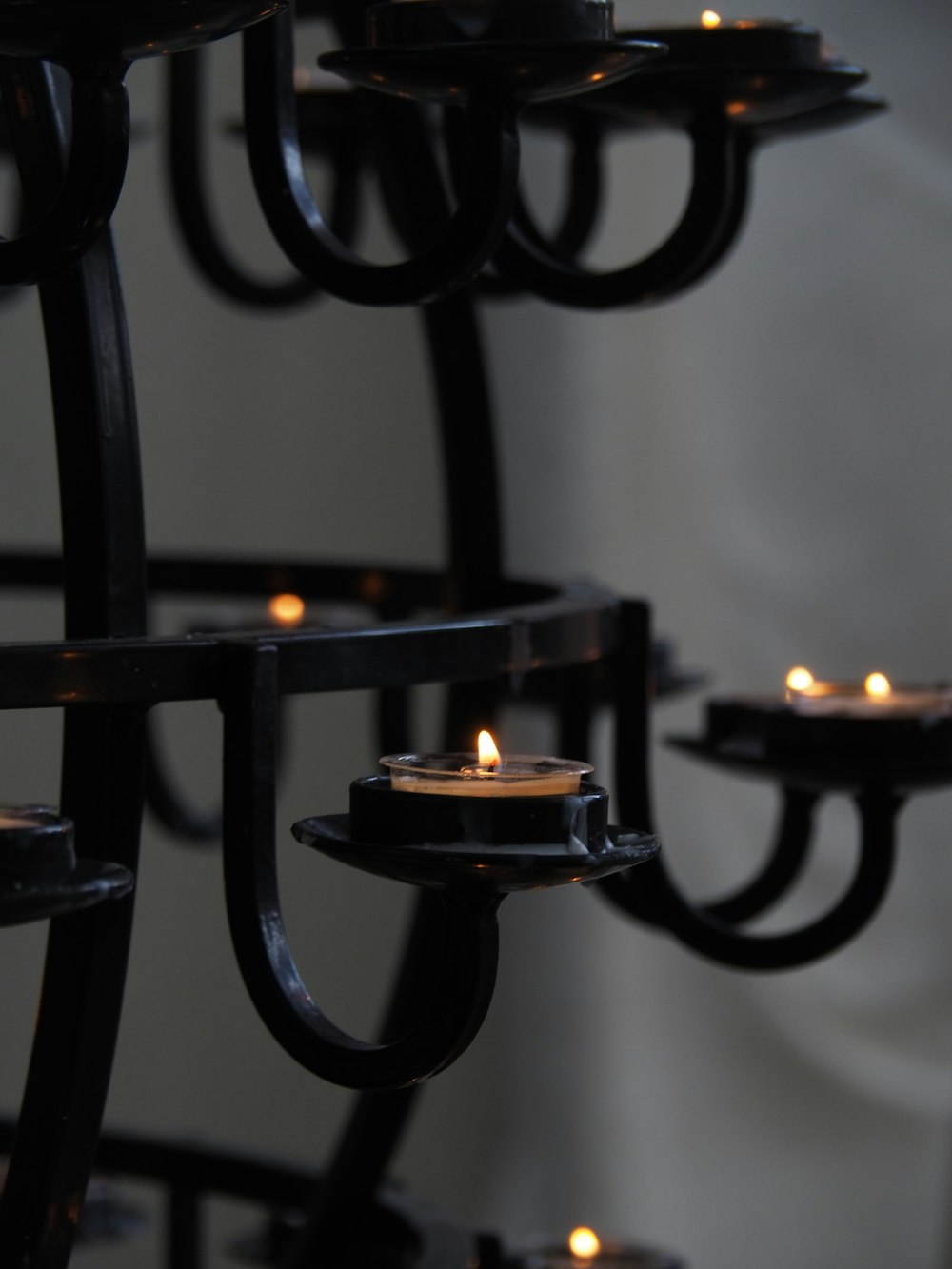 black metal candle holder with candles