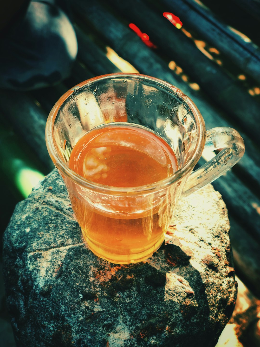 clear glass mug with brown liquid