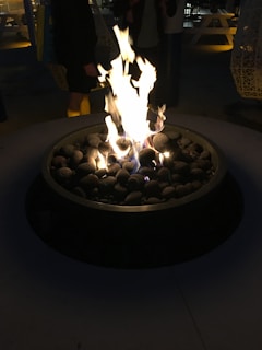 Elegant octagonal brasero glowing warmly outdoors during an evening gathering