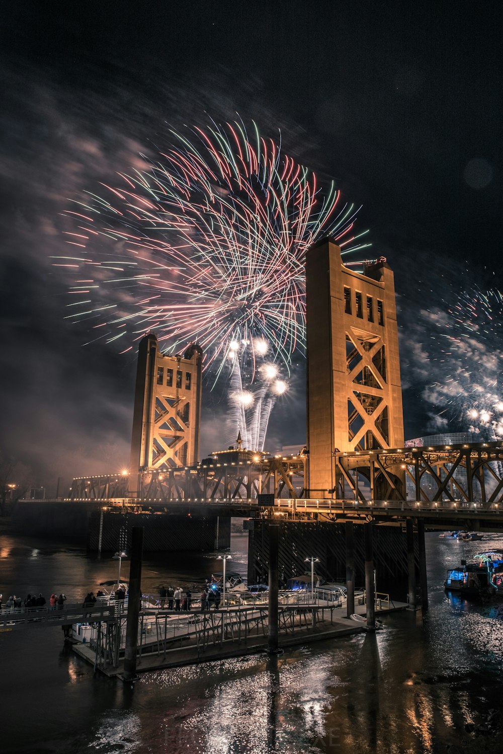 fireworks display over bridge during night time