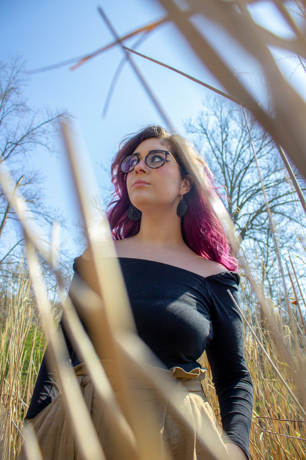 woman in black scoop neck shirt and black framed eyeglasses