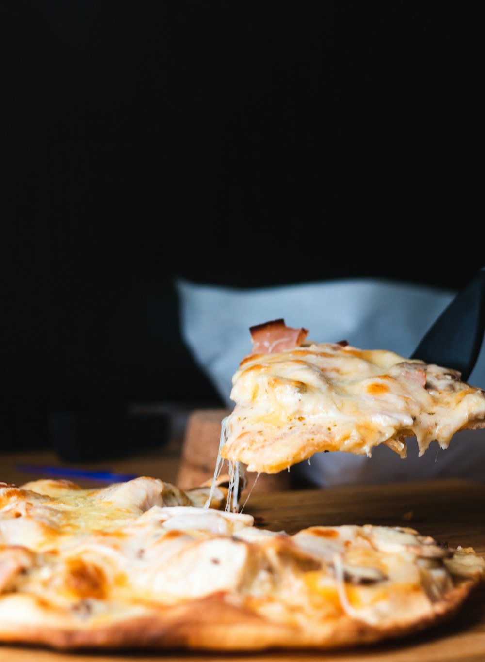 pizza on brown wooden table