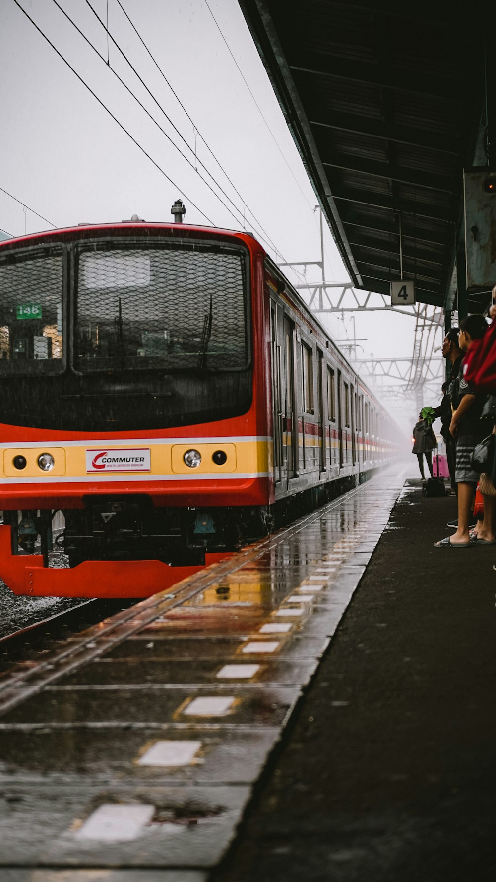 red and black train on train station during daytime