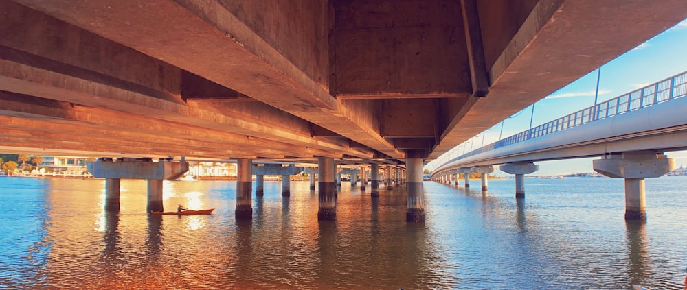 brown wooden dock over blue water