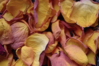 Artistic shot of a warm-toned varmala resin piece with embedded rose petals.