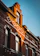 Close-up of a beautifully restored red brick facade glowing under soft sunlight.