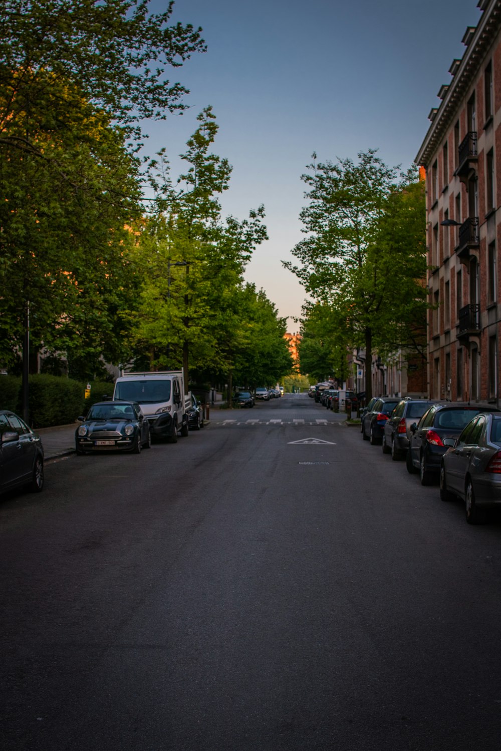 cars parked on the side of the road during daytime