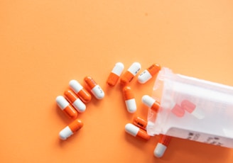 orange and white medication pill